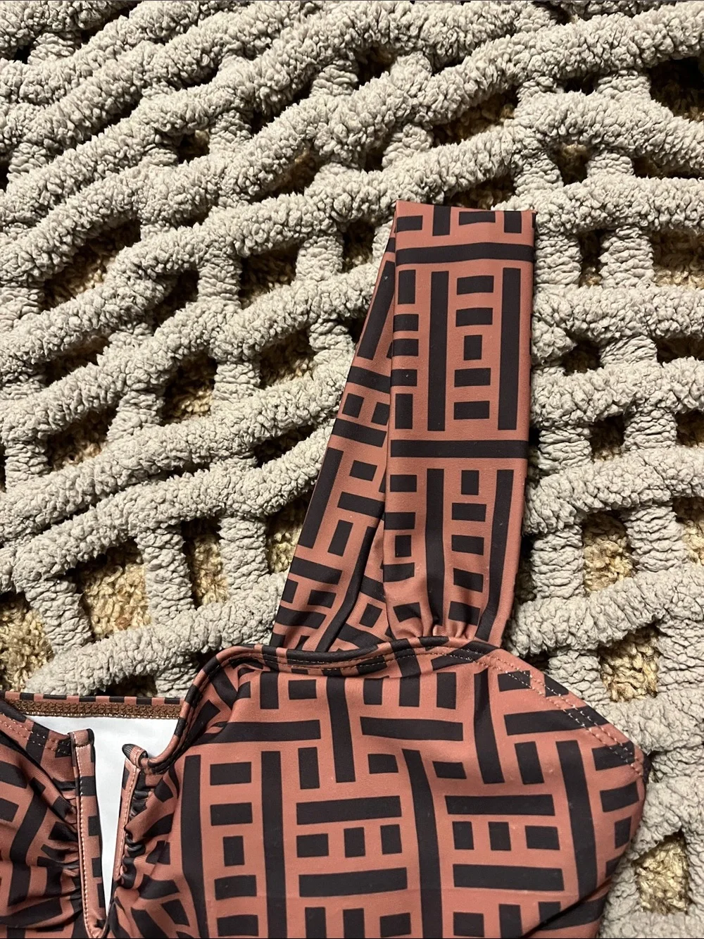 Pretty one piece swimsuit. Brown and black with sexy V cleavage and high hip cut